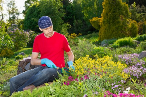 Gardeners working safely in a Motspur Park garden